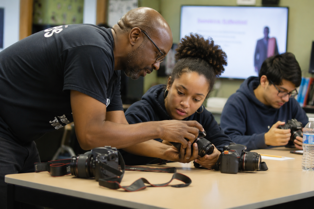 Male instructor teaching photography